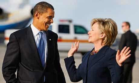 Barack Obama and Hillary Clinton talk after walking off his plane as they head to a campaign rally at Amway Arena in Orlando, Florida