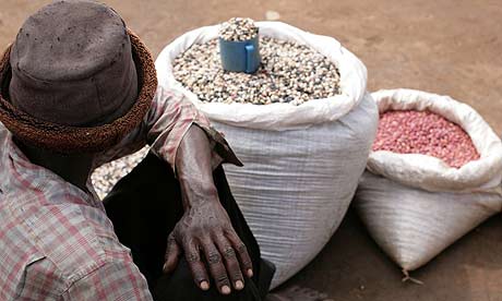 A man selling beans at Katine market