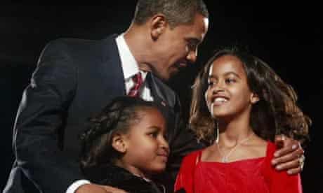 Barack Obama with his daughters Sasha and Malia. Photograph: Jason Reed/Reuters