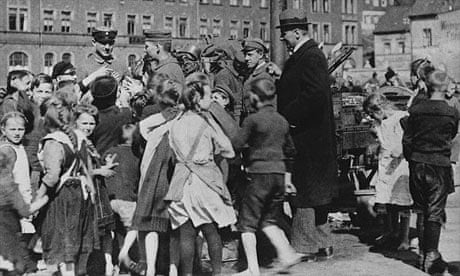 Children welcome German soldiers returning home after the declaration of the Armistice, 1918
