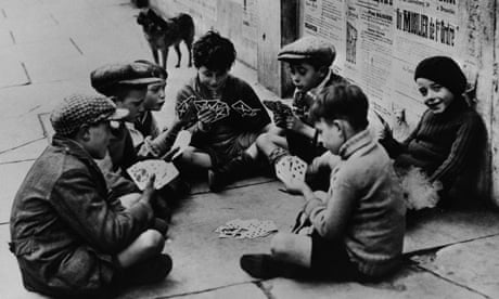 Homeless children play a card game in Paris during the second world war