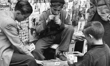 Boys play cards in the street