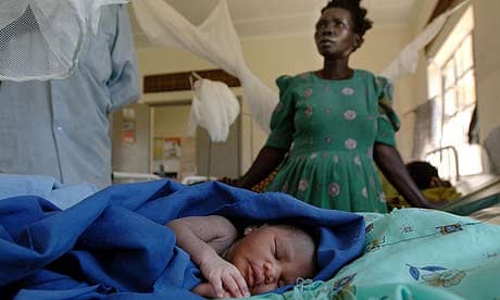 Florence Apeco with her newborn baby at Tiriri health centre, Katine, Uganda
