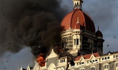 Smoke and flames pour from the Taj Mahal Hotel in Mumbai