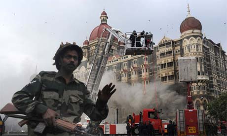 Soldier prevents people from approaching the Taj Mahal Hotel in Mumbai on November 29, 2008