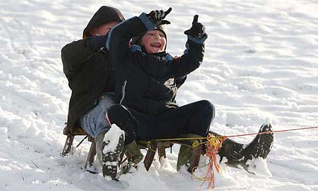 Children play in the snow in Ramsbottom, near Bury, Greater Manchester