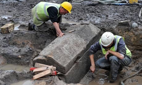 Archaeologists from Durham University clean a Roman stone sarcophagus
