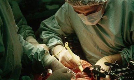 Surgeons performing a liver transplant operation