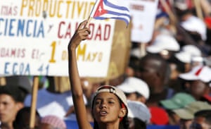 A girl waves a Cuban flag during the May Day parade at Havana's Revolution Square 