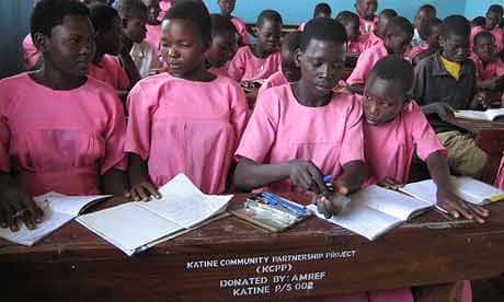 Pupils at Katine primary school share desks