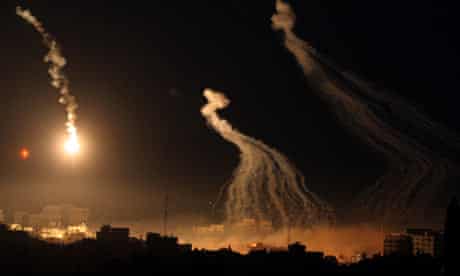 Flares and smoke are seen during an Israeli military operation in Gaza City 