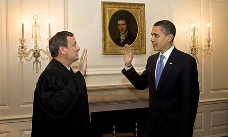 Barack Obama retakes the oath of office in the map room of the White House