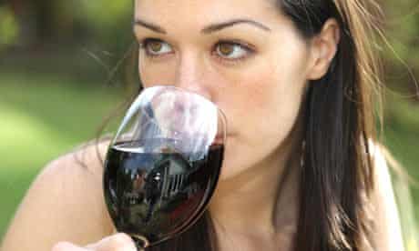 Young woman drinking a glass of red wine
Young woman drinking a glass of red wine
