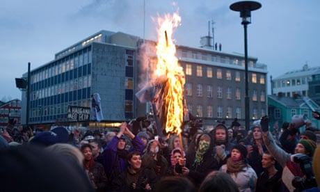 Protesters burn an effigy in Reykjavik