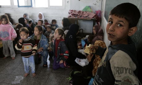 Palestinians who fled their homes from Israeli forces' operations gather in an UNRWA school building
