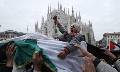 Demonstrators protest against  Israeli airstrikes in Gaza in front of Milan cathedral 