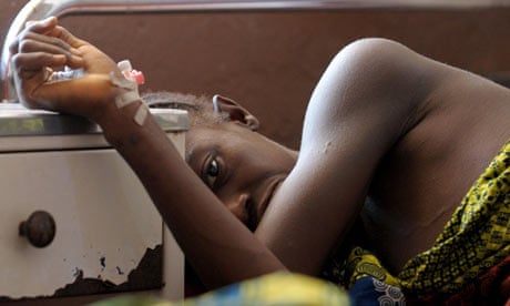 Woman waits in maternity ward in Sierra Leone