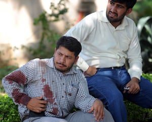Bomb in Islamabad: A blood-covered United Nations employee sits outside his office