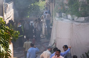 Bomb in Islamabad: Security officials and rescue workers survey the site of a bomb blast