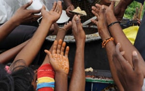 Flooding in India: Displaced villagers receive food in Oleru, Andhra Pradesh
