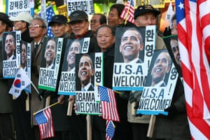 Obama in Asia: South Korean activists shout welcome slogans and hold portraits of Obama