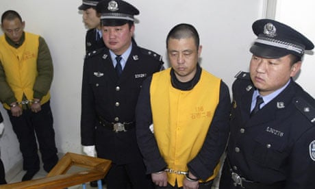 Zhang Yujun waiting to be put on trial in December 2008