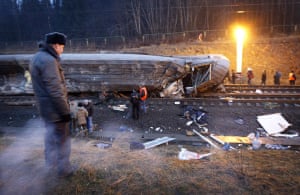 Russia Train Crash: A Russian police officer guards a damaged coach at the site of a derailment