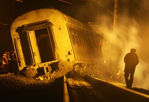 Russia Train Crash: Workers inspect a damaged railway carriage