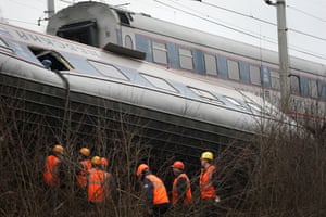 Russia Train Crash: Workers inspect a damaged railway carriage from a derailment