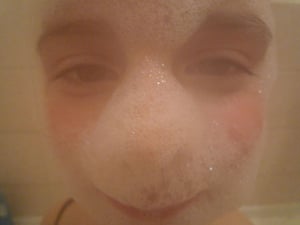 Kingsmead School: Paula's self-portrait with her face covered with bubbles