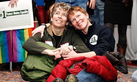 Gay marriage supporters Susan McCray (l) and Yvette Pratt watch election results in Portland, Maine.
