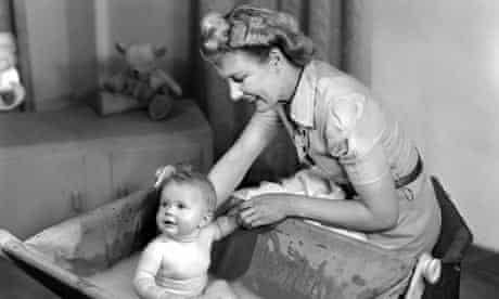 Woman bathing a baby, 1948