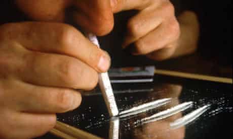 A man snorting cocaine