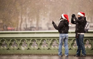 December weather: Tourists take photographs on Westminster Bridge