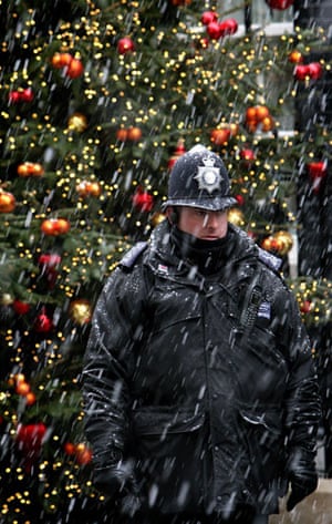 December snow: A police officer stands outside 10 Downing Street, Westminster