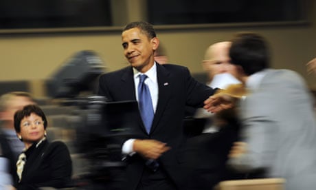 Barack Obama as he walks through the press conference room at the Bella Centre