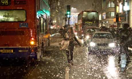 Snow falls on Oxford Street in central London
