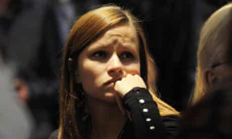 A woman listens to Barack Obama's speech at Copenhagen climate change conference 18 December 2009
