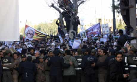 Iranisn police hold back Montazeri mourners