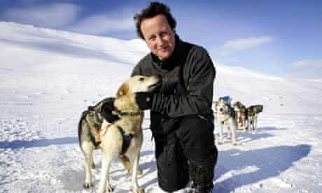 David Cameron with a husky called Troika on Svalbard, Norway
