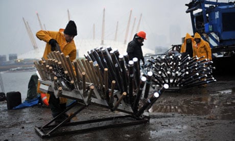 New Year fireworks are prepared on barges on the River Thames in London