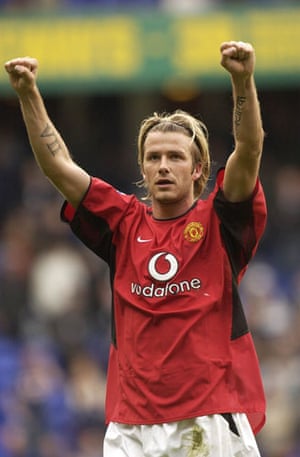 David Beckham hair: April 2003: David Beckham celebrates victory at the end of a match