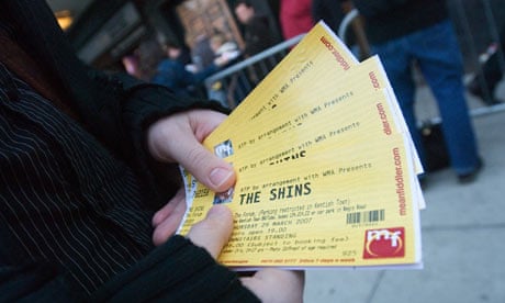 A ticket tout outside a London gig&#13;A ticket tout holds outside a London gig.&#13;