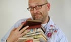 Tim Hayward holds a pile of old recipe books