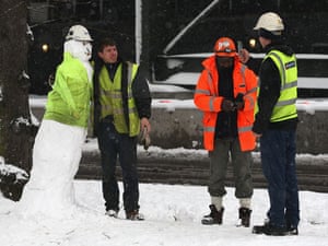 Gallery Snowman gallery: London: Construction workers pose with a snowman in Hyde Park.