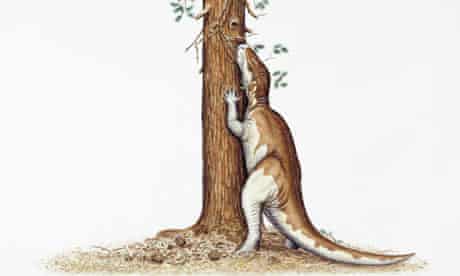 Camptosaurus dinosaur eating leaves from a tree