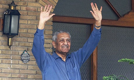 Pakistani nuclear scientist Abdul Qadeer Khan waves after his release from house arrest in Islamabad