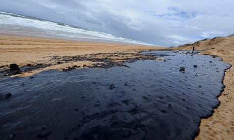 A huge oil slick on Warana beach