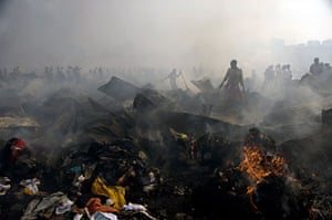 Owino market fire: Traders salvage goods in Owino market, in Kampala, Uganda, after a fire.
