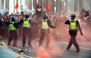G20 protests and security: Police attempt to subdue the crowds near the Bank of England.